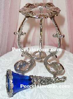 blue glass with rose bouquet holder